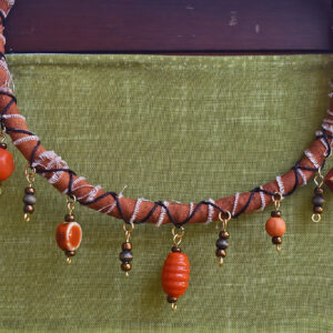 orange necklace product shot